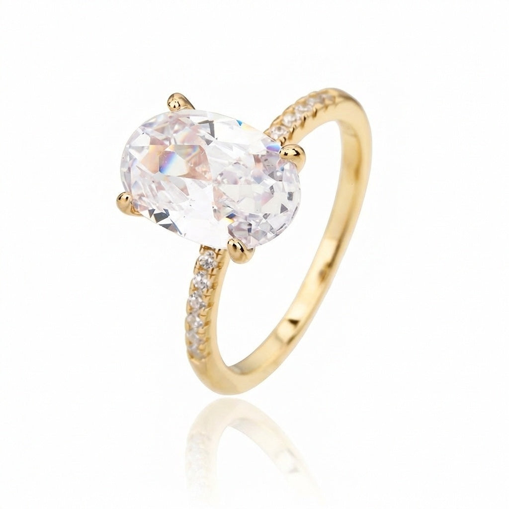 טבעת זהב עם אבן אליפסה ושיבוץ